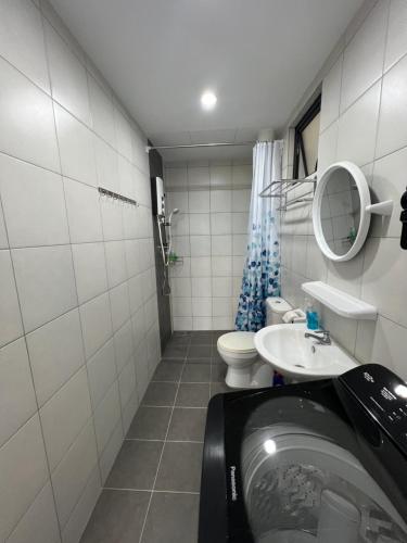 a small bathroom with a sink and a toilet at New The Sun Homestay at Sg Nibong nearby Queensbay or PISA or FTZ Bayan Lepas HENG in Bayan Lepas