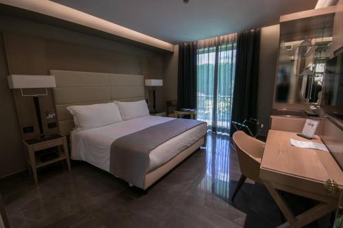 Letto o letti in una camera di Hotel Forum