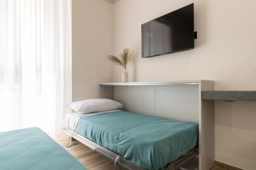 Postel nebo postele na pokoji v ubytování Hispirya Rooms