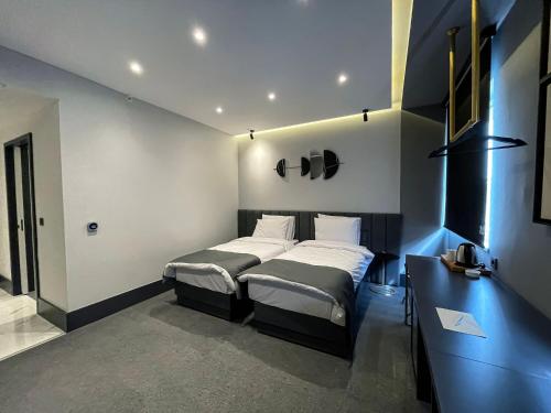 Posteľ alebo postele v izbe v ubytovaní MELLDAY HOTEL