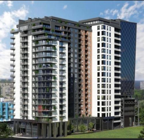 een weergave van een hoog appartementencomplex bij Люкс апартаменти в затишному ЖК бізнес класу in Kiev