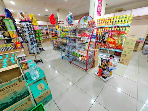 a store filled with lots of toys and other items at Paragon Water Themepark Suites Melaka by GGM in Melaka