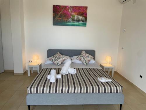 Łóżko lub łóżka w pokoju w obiekcie -DIMARTINO HOME- Posizione centrale 9 min da Marzamemi San Lorenzo Portopalo di Capo Passero