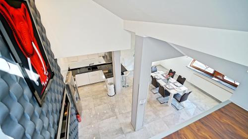 an overhead view of a kitchen with a table and chairs at Apartamenty Every Sky Kopernika 3 in Jelenia Góra