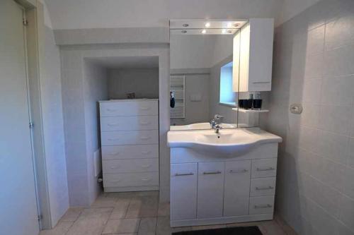 A bathroom at Trullo Antico with exclusive swimming pool