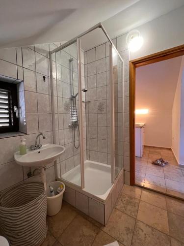 a bathroom with a shower and a sink at Apartment 39 in Vir