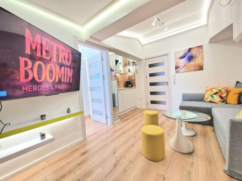 a living room with a couch and a table at Art Apartment + 2BD parking space in Varna City