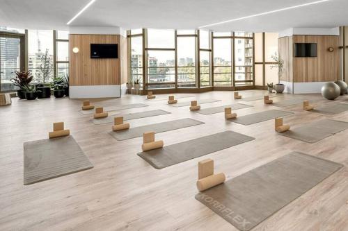 a large room with yoga mats on the floor at Spencer St 1bd Lvl 47 Melbourne CBD in Melbourne