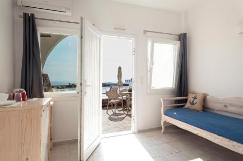 A bed or beds in a room at Caldera Butterfly Villas