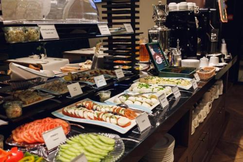a buffet line with many different types of food at Hotel Royal & Spa in Białystok