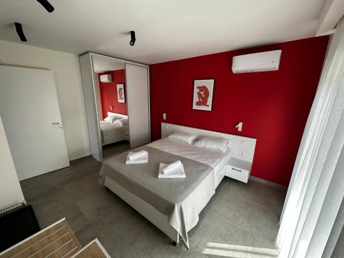Ένα ή περισσότερα κρεβάτια σε δωμάτιο στο Lighthouse Apartments