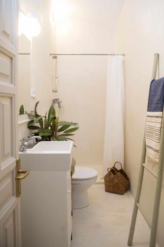 a bathroom with a sink and a toilet and a shower at unic views begur, alojamiento turístico in Begur