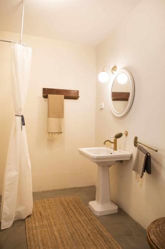 a bathroom with a sink and a mirror at unic views begur, alojamiento turístico in Begur