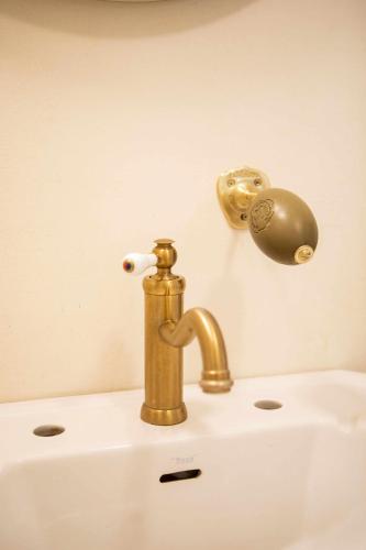 a brass faucet on top of a sink at unic views begur, alojamiento turístico in Begur