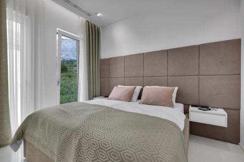 Ένα ή περισσότερα κρεβάτια σε δωμάτιο στο Penthouse DALS Exclusiv - Makarska Exklusiv