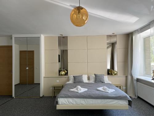 Postel nebo postele na pokoji v ubytování Hotel "Senleja"