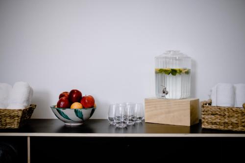 a table with a bowl of fruit and a blender at THE FLAG HOTEL Marbella, Estepona Adult Recommended in Estepona