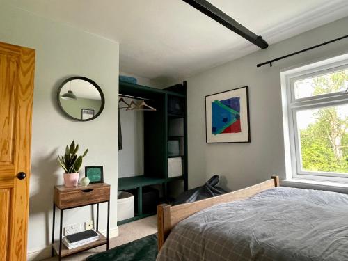 Voodi või voodid majutusasutuse Quiet & Cosy 2-Bedroom Cottage in Coltishall toas