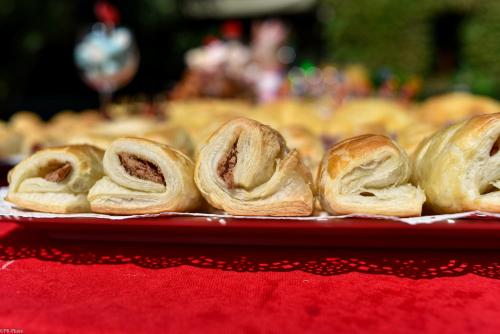 a bunch of rolls on a plate on a table at Tiflis Hotel in Tbilisi City