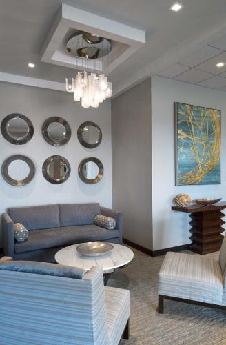 a living room with a couch and a table at Ashworth by the Sea in Hampton