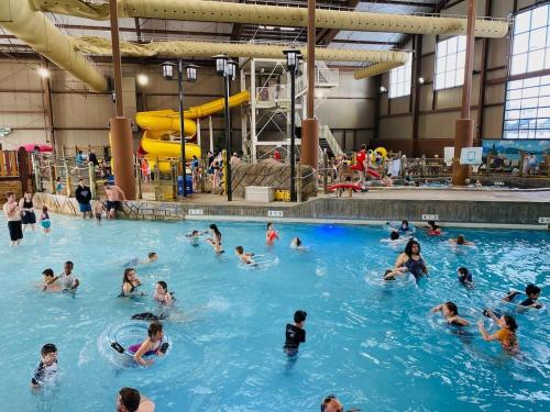 a group of people swimming in a swimming pool at Virgil Mountain View 