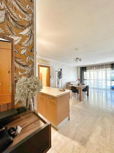a living room with a desk and a dining room at Vittory house in Lido di Ostia