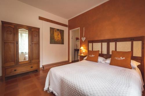 a bedroom with a large bed and a window at Podere San Filippo B&B-Apartment-Pet Friendly-Rent Bike and Bike Friendly in Bibbona