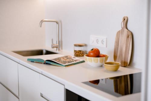 a kitchen counter with a sink and a bowl of fruit at THE FLAG HOTEL Marbella, Estepona Adult Recommended in Estepona