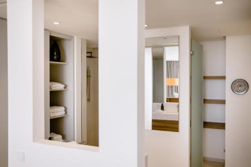 a hallway with two mirrors and a bathroom at THE FLAG HOTEL Marbella, Estepona Adult Recommended in Estepona