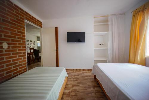 Кровать или кровати в номере Casa las ruelias