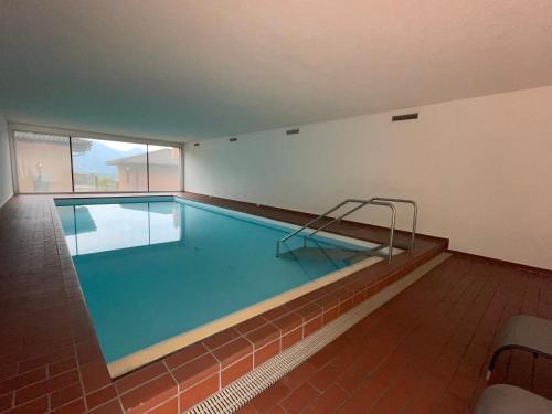a large swimming pool in a building at Muralto-Locarno: Collina Apt. 32 in Muralto