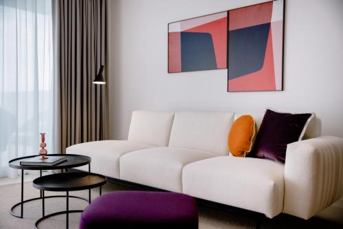 a living room with a couch and a table at THE FLAG HOTEL Marbella, Estepona Adult Recommended in Estepona