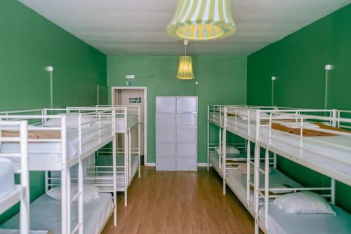 Letto o letti in una camera di Urban Garden Hostel