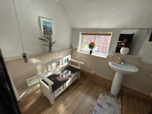 a small bathroom with a sink and a sink at Entire 2 Bedroom Cottage in Whitby in Whitby