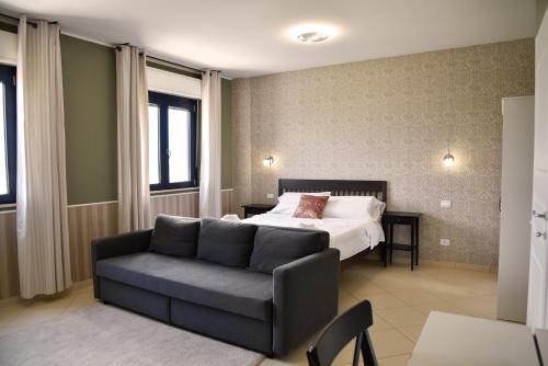 A bed or beds in a room at La Maison Latina Guest House