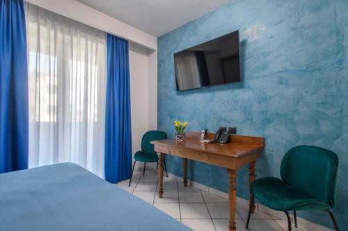 Postel nebo postele na pokoji v ubytování Hotel Ancora