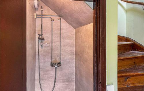 a shower in the corner of a room at Nice Apartment In Mantorp With Kitchen in Mantorp