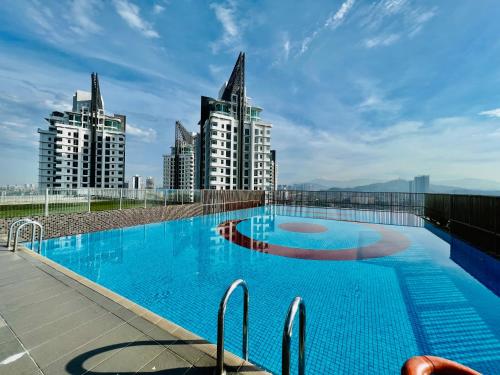 a swimming pool on the roof of a building with tall buildings at 3 Towers Klcc By Tenang Homes in Kuala Lumpur