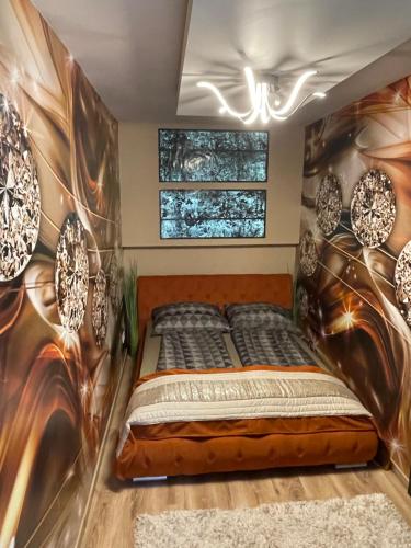 a bedroom with a bed in a room at Mox Downtown Apartman in Debrecen