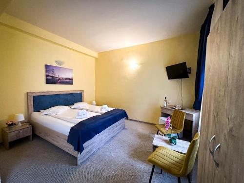 מיטה או מיטות בחדר ב-Hotel Pin Azuga