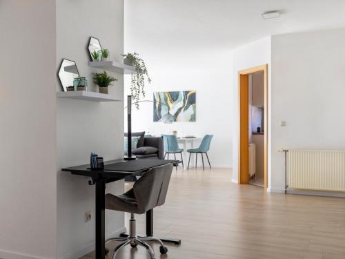 TV a/nebo společenská místnost v ubytování Arena in der Nähe - Tiefgarage - Balkon - Küche - Smart TV