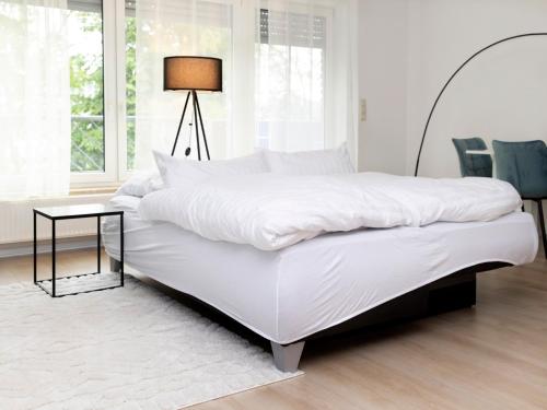 Posteľ alebo postele v izbe v ubytovaní MICOA: Tiefgarage/Netflix/Highspeed Arbeitsplatz