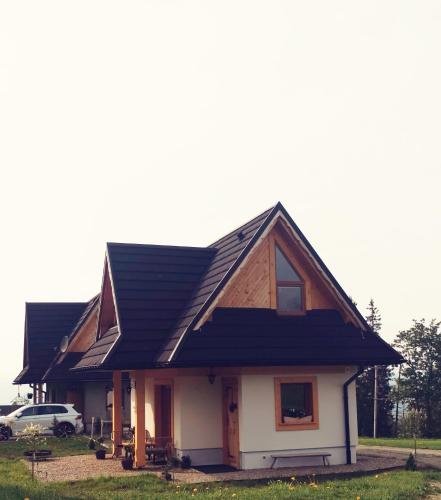 a house with a gambrel roof at Heidi in Zakopane