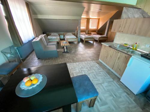 an overhead view of a living room with a table with fruit on it at Vista Point Apartment in Bajina Bašta