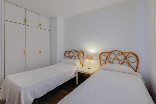 A bed or beds in a room at BA Paseo Del Dintre