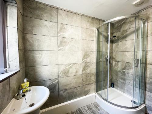 a bathroom with a sink and a shower at Charming Retreat in the heart of the City in Liverpool