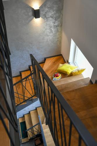 a staircase leading to a room with a bed in it at Kuća za odmor Bubamara in Ravna Gora