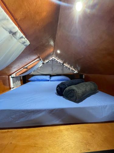 a large bed in a small room in a tent at Chalé Roma Negra in Morro do Chapéu