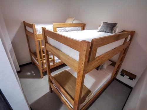a couple of bunk beds in a room at Casa García Rent Home in Guatapé