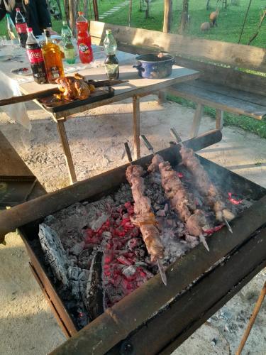 a grill with some meat on top of it at Eagle Nest in Martvili